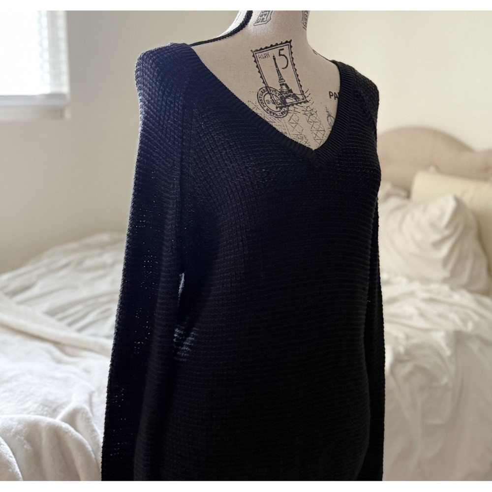 - [ ] Calvin Klein black V-neck sweater